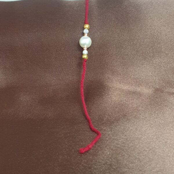 Elegant Pearl & Gold Beaded Rakhi